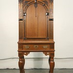 Антикварный шкаф с арочным резным убранством на высоких ножках 1860-х гг.  