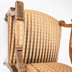 Старинное низкое кресло из светлого резного ореха