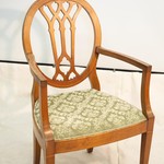Антикварное кресло с овальной сквозной спинкой и мягким сиденьем 1910-х гг.