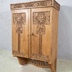 Настенный шкафчик с контррельефными композициями 1900-х гг.