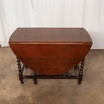 Антикварный стол с откидными полами темного дуба 1910-х гг. 