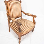 Старинное низкое кресло из светлого резного ореха