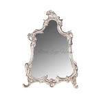 Серебряное зеркало в фигурной раме