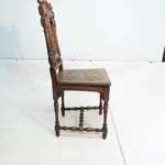 Антикварный стул с резными композициями 1850-х гг.