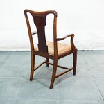 Антикварное кресло с фигурной спинкой 1890-х гг.