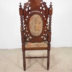 Антикварное кресло с резными деталями 1870-х гг.