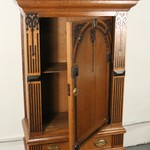 Антикварный шкаф с арочным резным убранством на высоких ножках 1860-х гг.  