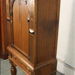 Антикварный шкаф с арочным резным убранством на высоких ножках 1860-х гг.  